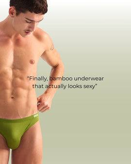 Man wearing a green underwear brief