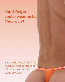 Man wearing an orange thong